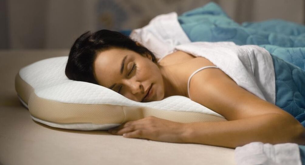 lying on an orthopedic pillow for cervical osteochondrosis
